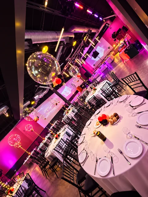 Round tables with illuminated balloon centerpieces