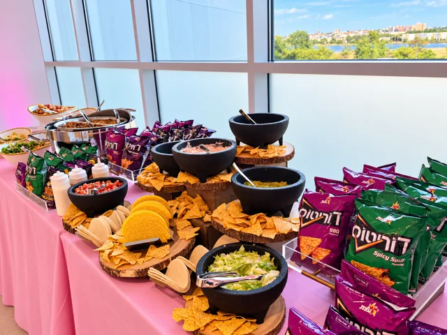Nacho station with chips and assorted toppings