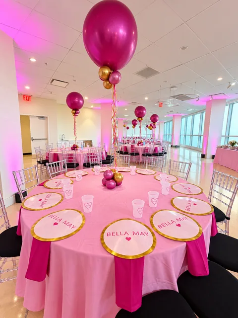 Pink tablescape with balloon centerpieces