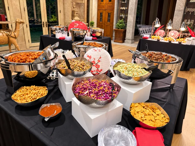 Hot buffet with salads and Asian-inspired decorations