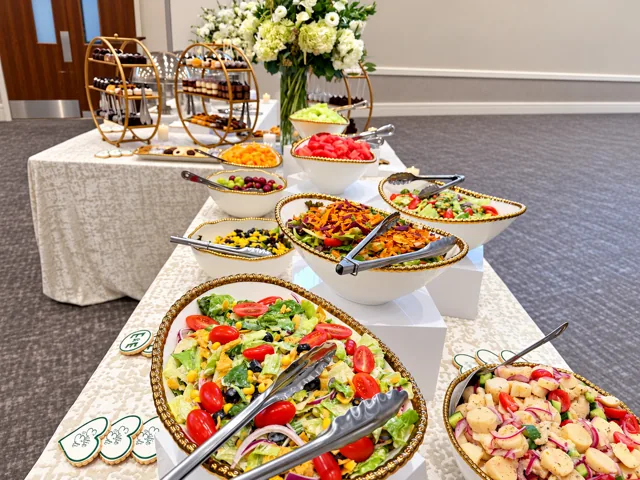 Salad and fruit buffet on ivory linens