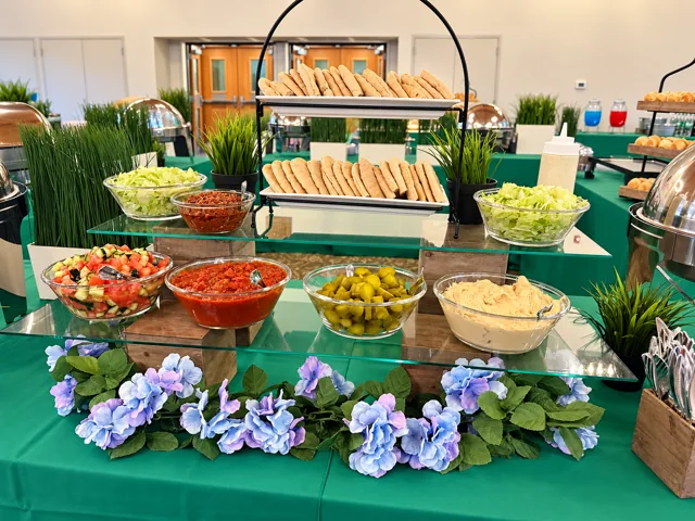 Tiered pita and dip display with hydrangeas