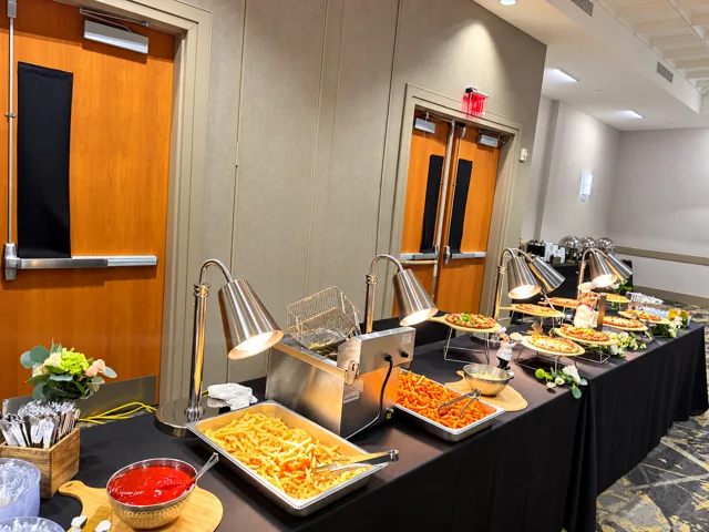 Hot food buffet with silver heat lamps