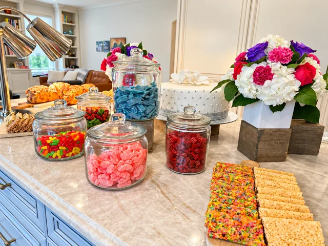 Candy and cereal treats with floral arrangements