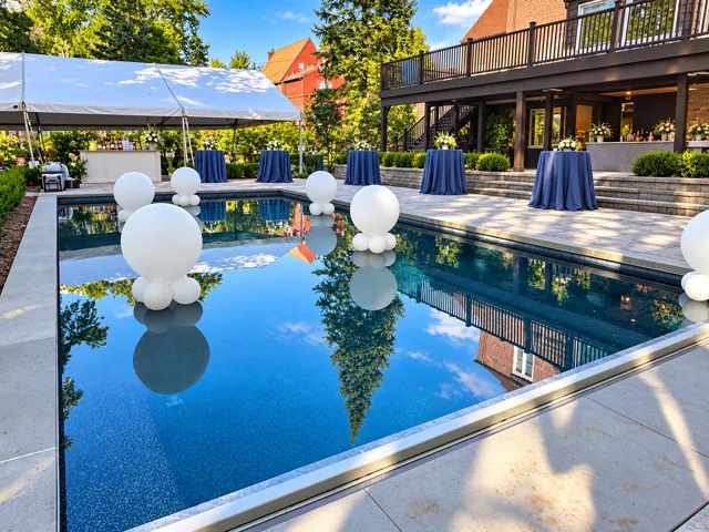 Poolside event with white balloon decorations