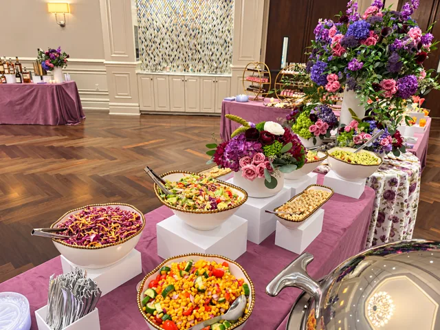 Salad buffet with purple flowers