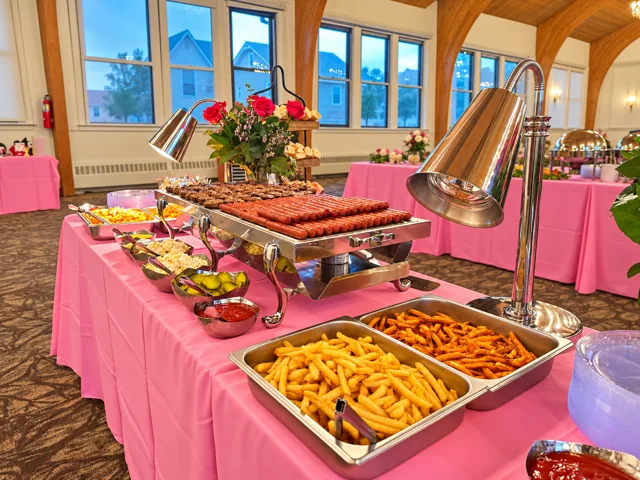 Hot food display on pink linens
